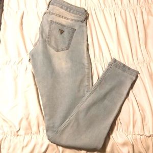 Light blue denim skinny Guess jeans.
